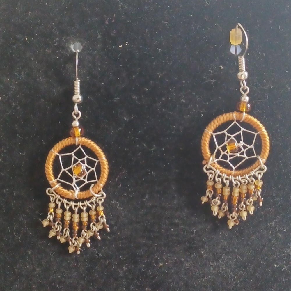 Homemade native American Dreamcatcher earrings. Brown and gold.